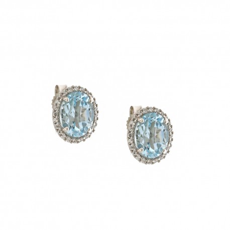 Boucles d'oreilles en or blanc 18 Kt 750/1000 avec pierre centrale bleue et zircons blancs
